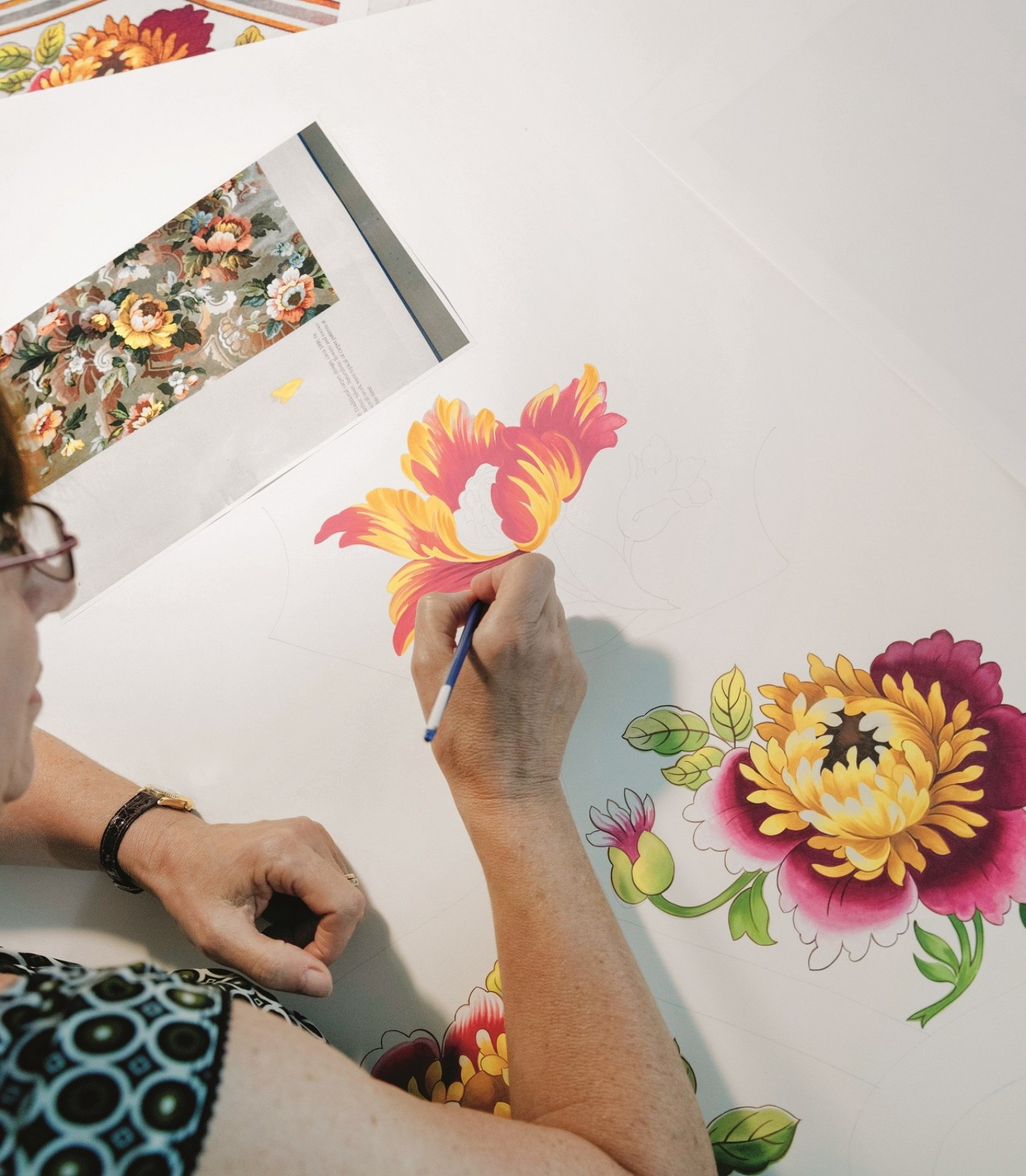 A floral design is painted on paper