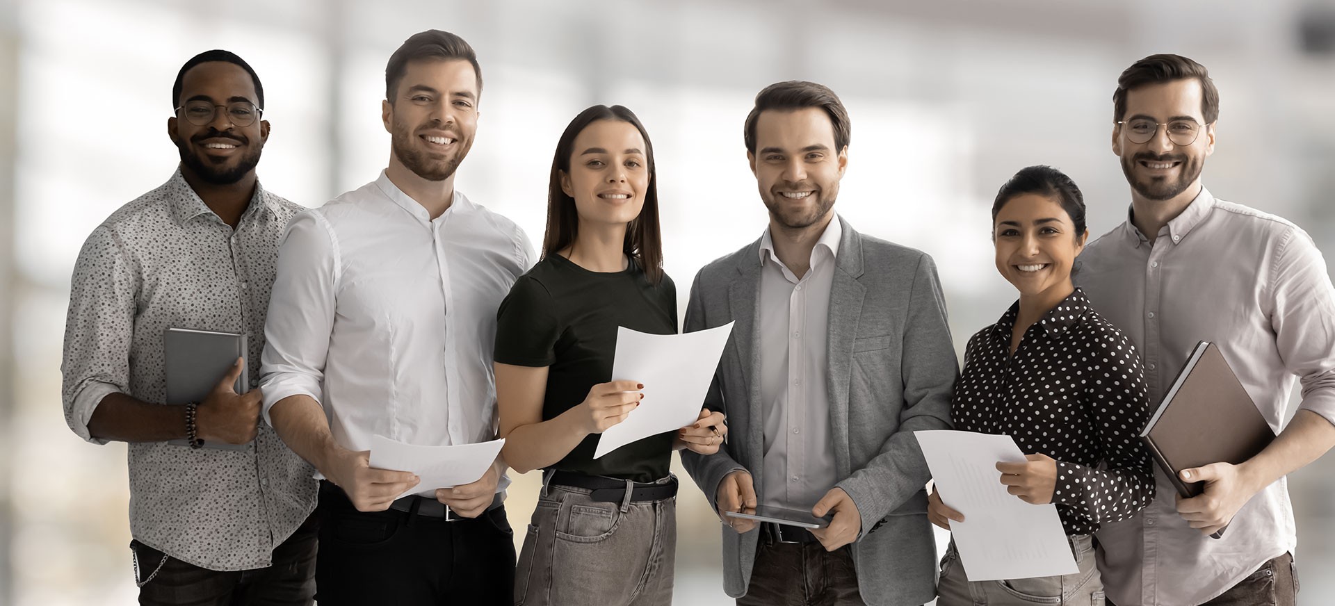 group of professionals smiling to the camera