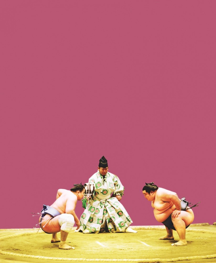 Two sumo wrestlers prepare for battle. 