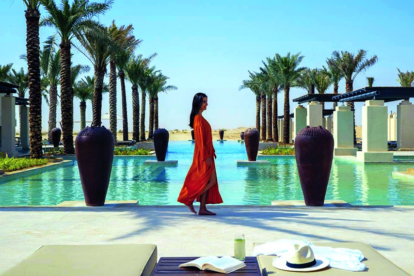 Woman walking at the Qasr Al Sarab resort in Abu Dhabi    