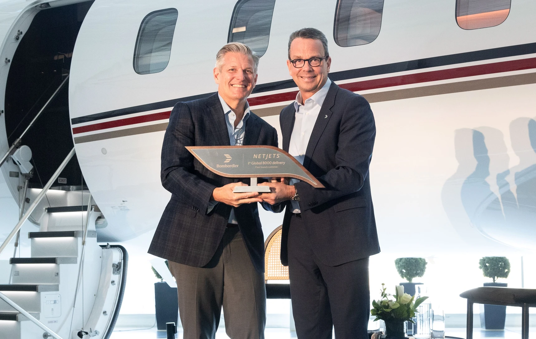 NetJets’ Patrick Gallagher (left) and Bombardier’s David Murray celebrate the delivery of NetJets’ first Global 8000 business jet.