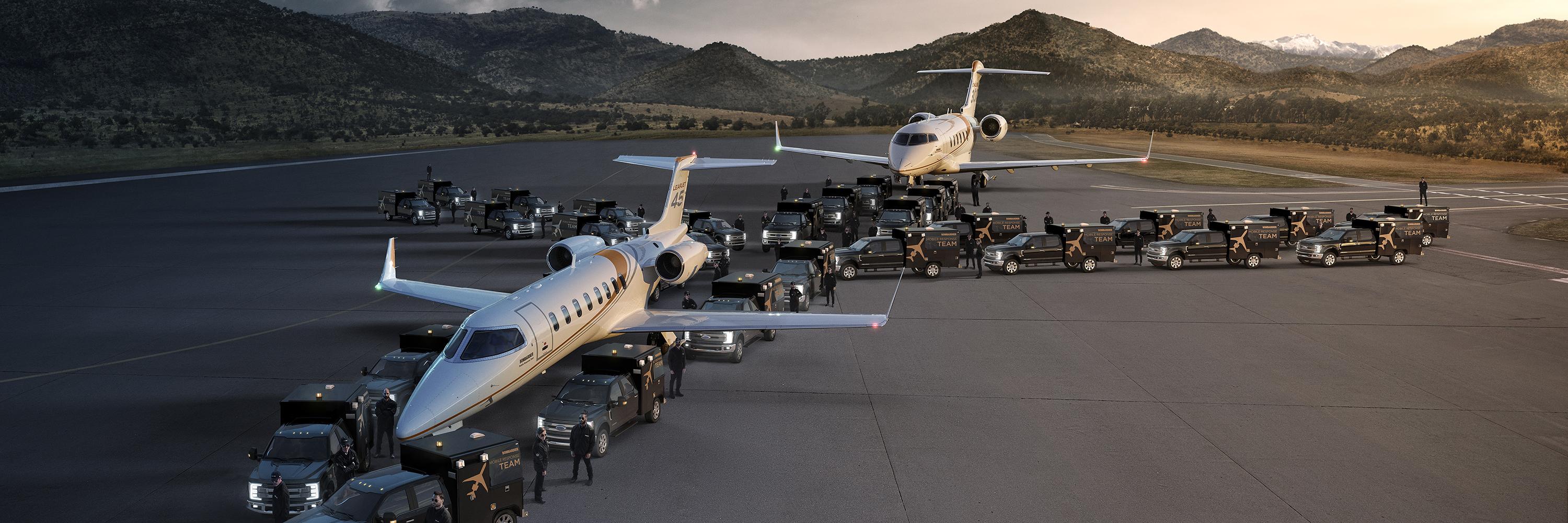 mobile response team personnel and trucks surrounding two planes on a runway during twilight