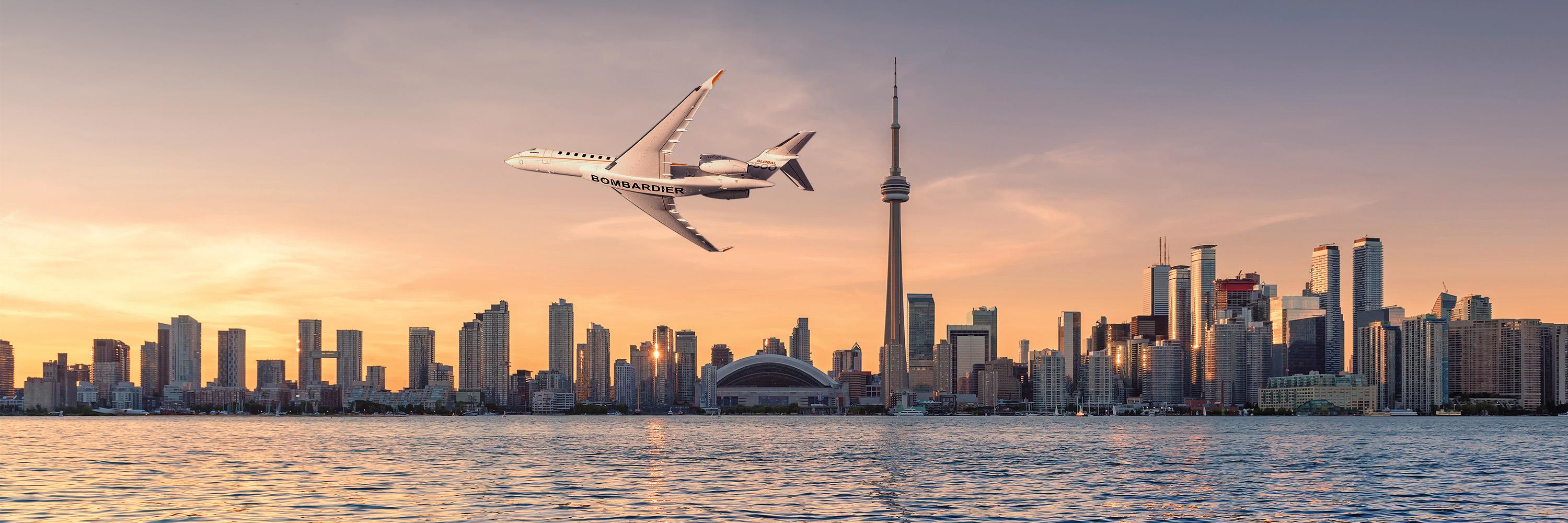 aircraft flying over Toronto city landscape